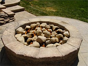 Gas firepit with natural river rock inside